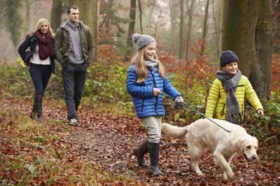 family-walking-dog